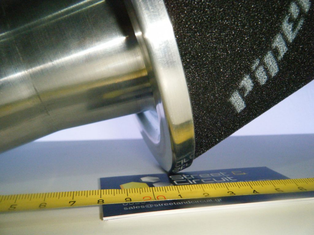 Picture of a cone filter on its side with a tape measure
